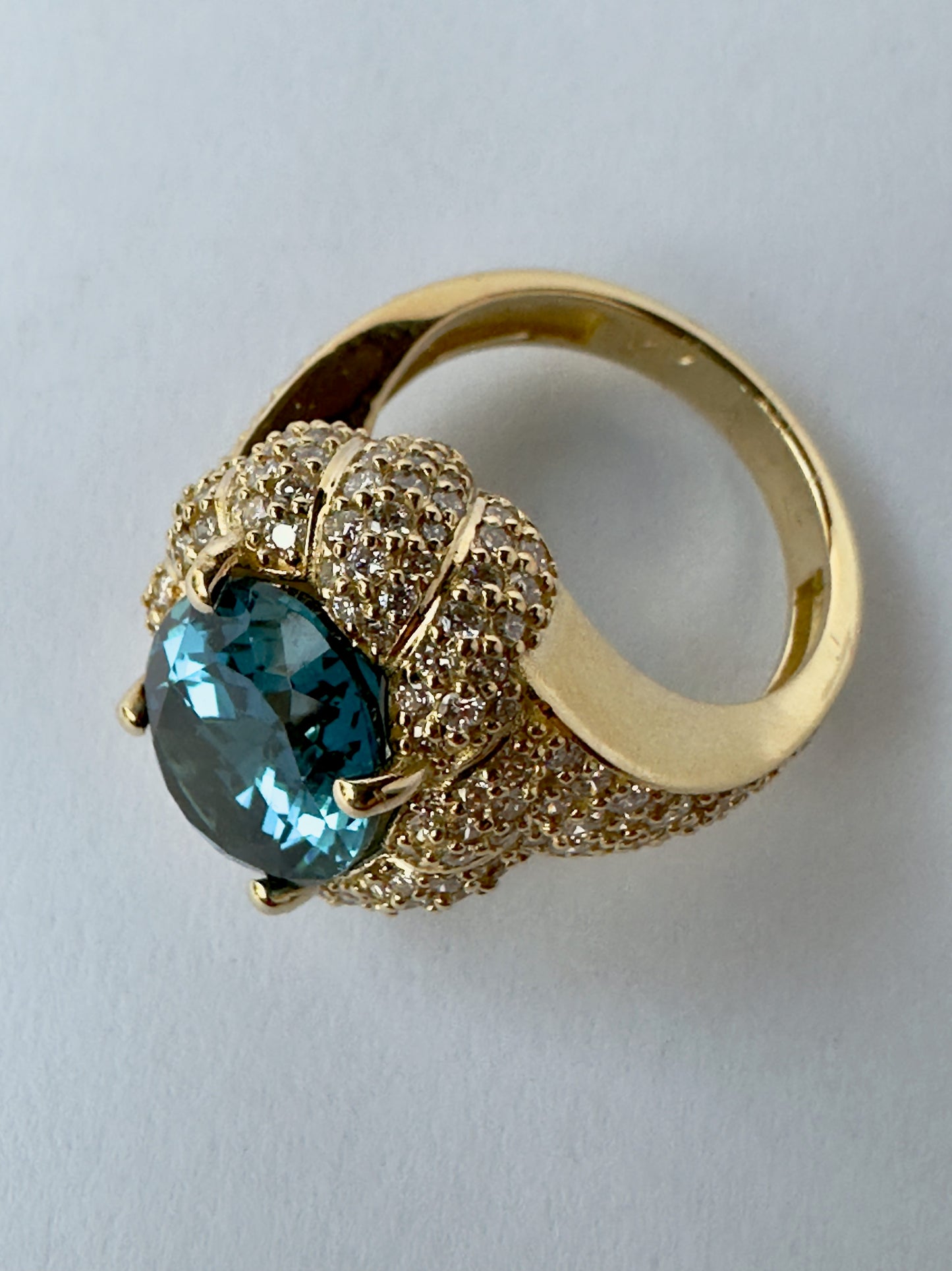 7 Carat Oval-Cut London Blue Topaz and Diamond Halo Ring